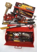 An assortment of tools, to include a workbench vice, saw and a mallet,