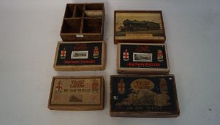 An assortment of train related wooden Jig-Saw puzzles, in the original boxes,