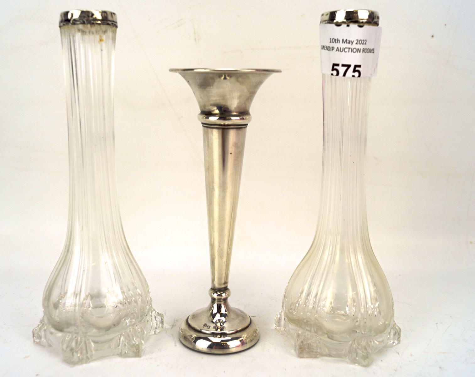 A silver trumpet vase and two silver mounted glass vases,