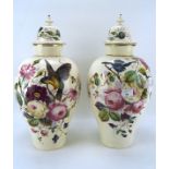 A pair of 20th century lidded vases,