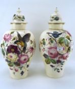 A pair of 20th century lidded vases,