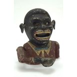 An original 1930s Starkies 'Jolly Man' money box, reg no.