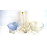 An assortment of glassware, including a blue bowl, punch bowl set, engraved tankards,