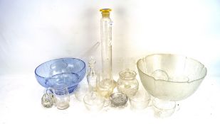 An assortment of glassware, including a blue bowl, punch bowl set, engraved tankards,