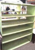A set of retro metal and wood wall shelves, the frames painted in grey and green with four shelves,