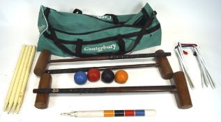 Assorted croquet related items, including mallets, balls and wickets,