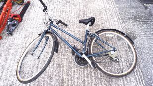 A Trek 700 Sport push bike with green frame