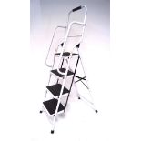 A folding step ladder, four steps, model EN14183,