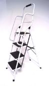 A folding step ladder, four steps, model EN14183,