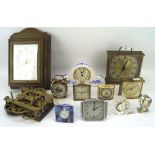 An assortment of small desk clocks and similar wares, including brass, ceramic,