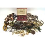 An assortment of costume jewellery, including a hardstone necklace, beads, a bangle, earrings,