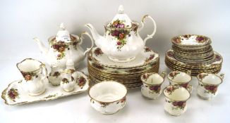 A Royal Albert Old Country Roses part tea and dinner service, including; two teapots, teacups,