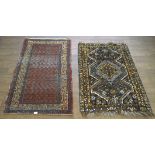 Two 20th century wool blend rugs,