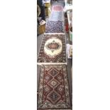 A selection of six floor rugs, of varying sizes and designs,