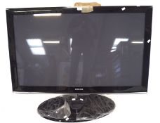 A Samsung plasma screen television and stand, with cables,