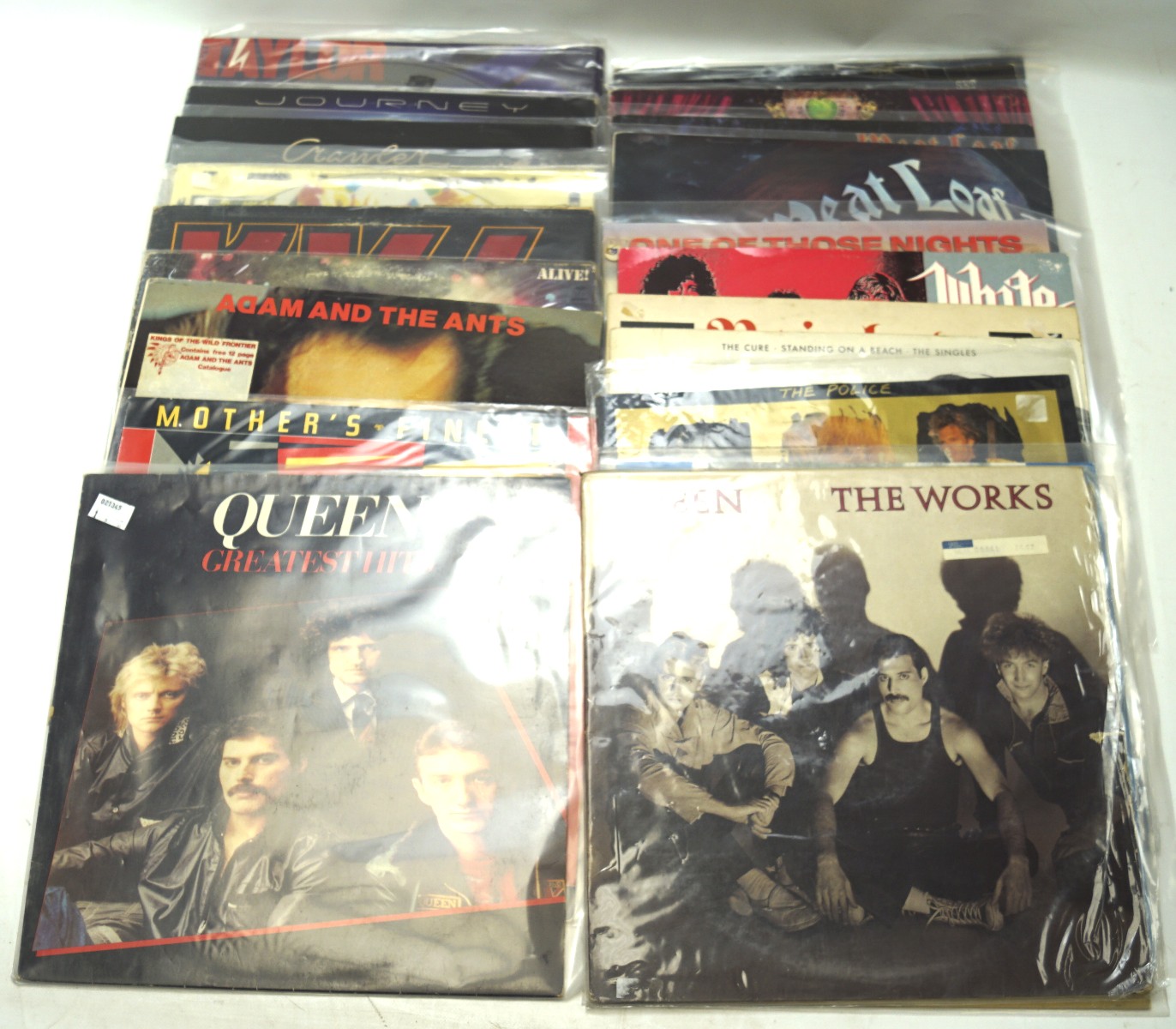 A collection of mostly heavy metal vinyl records, including Queen,