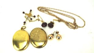 An assortment of gold and yellow metal jewellery, comprising a pair of garnet set earrings,