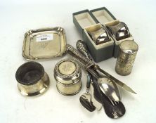 An assortment of silver and white metal, including napkin rings, square tray, flatware,