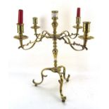 A 19th century five sconce four arm brass candleabra, the drip trays with engraved decoration,