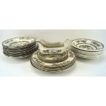 A quantity of dinner services pieces, most in the Indian Tree pattern,