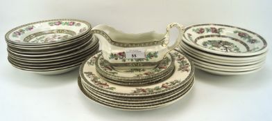 A quantity of dinner services pieces, most in the Indian Tree pattern,