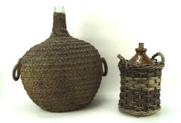 Two 20th century alcohol vessels in wicker holders, including a Doulton ceramic comport vessel,