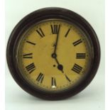 An early 20th century oak cased wall clock, the yellowed dial with Roman numerals denoting hours,