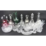 An assortment of glassware, including five decanters, a candlestick, salad bowl, green ewer,
