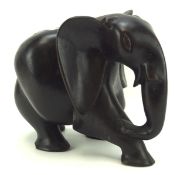 A large carved ebony figure of an African elephant,