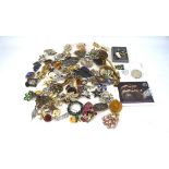 A large assortment of costume jewellery, mostly brooches,