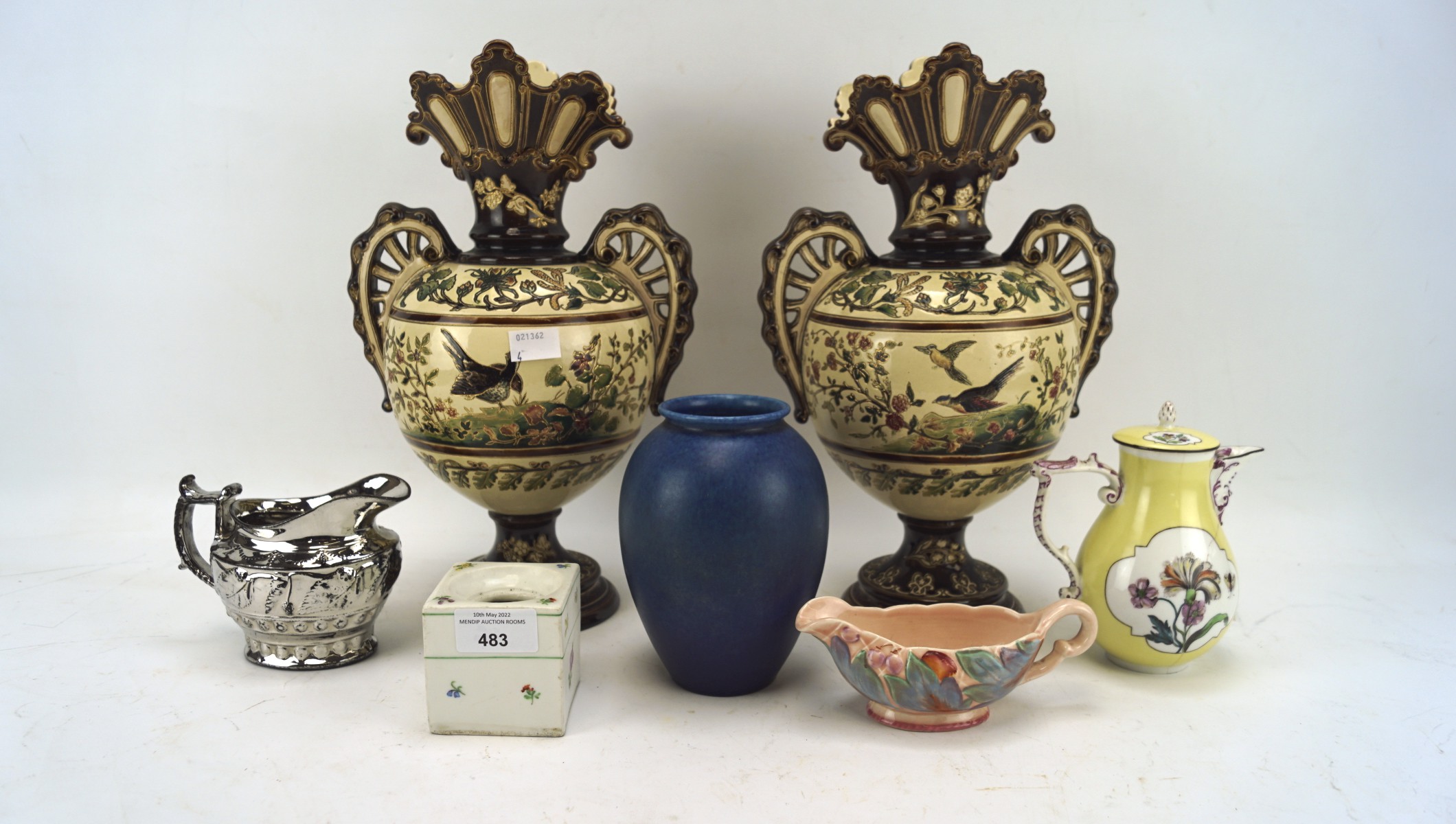 An assortment of 20th century ceramics, including a pair of vases, a Clarice Cliff sauceboat 40A,