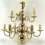 A 20th century brass nine light chandelier, in the antique Dutch style with two tiers,