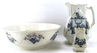 An early 20th century ceramic wash basin set, comprising pouring jug, basin and a small vase,