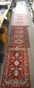 Five 20th century floor rugs, of varying sizes and designs,