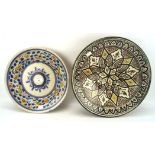 Two 20th century Moroccan ceramic dishes, of circular form, colourful decoration,