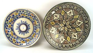 Two 20th century Moroccan ceramic dishes, of circular form, colourful decoration,