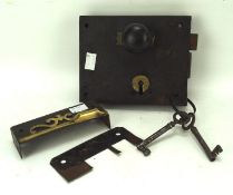 An antique door lock, with a black handle and a set of keys, lock 17.