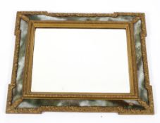 A Victorian rectangular giltwood mirror frame with mottled green and white glass border,