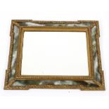 A Victorian rectangular giltwood mirror frame with mottled green and white glass border,