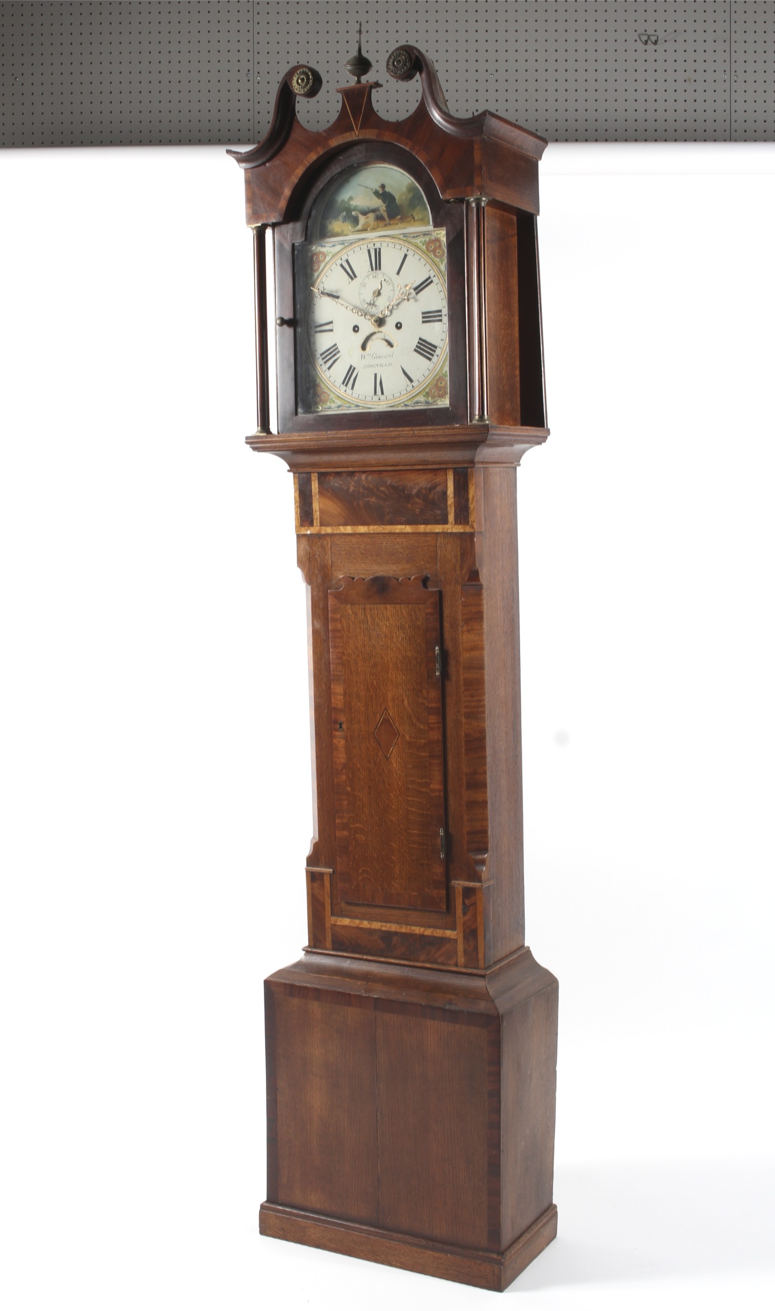 An early 19th century oak longcase clock, the white painted dial named for Wm Giscard/Downham,