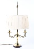 A 20th century brass two-light candelabra table lamp with two candlestick scones,