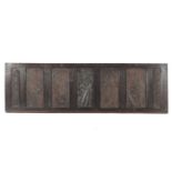 A framed 16th century oak relief carved panel and six later carved panels,