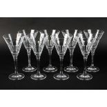 Eight modern large wine or cocktail glasses, with conical fluted bowls, on faceted stems,