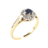 An 18ct yellow gold sapphire and diamond cluster ring,