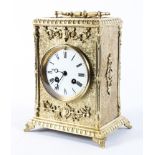 A Victorian brass and gilt-metal mounted eight day striking mantel clock,