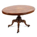 A Victorian inlaid walnut loo table, the oval top raised on a turned column to a quadrofoil base,