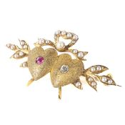 An 18ct gold diamond and ruby sweetheart brooch,