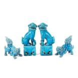 A group of four turquoise glazed pottery dogs of fo,