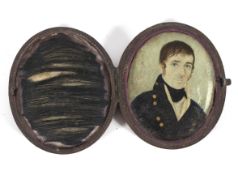 A Georgian portrait miniature of a gentleman on ivory, of oval form, in brown leather,