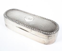 A silver lidded box with engine turned decoration to the lid, monogramed EMW to the central plaque,